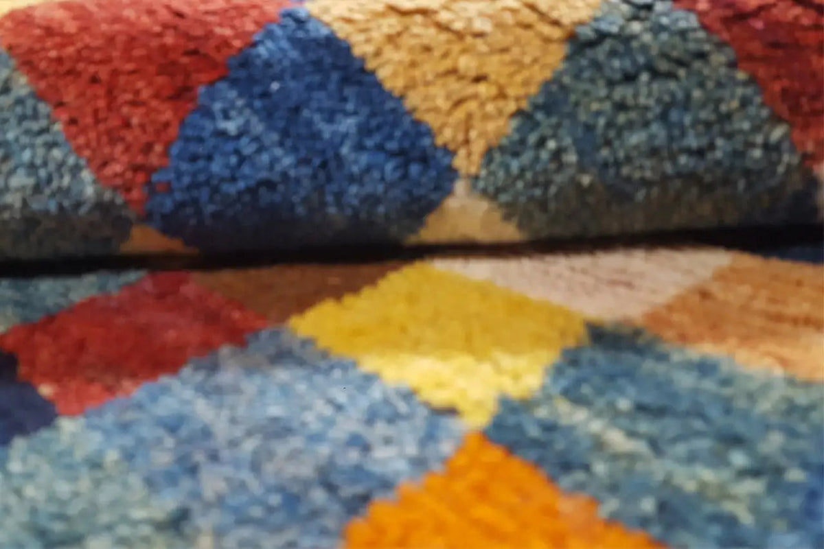 Close-up of the carpet surface with a dense pile and blue-red color fields