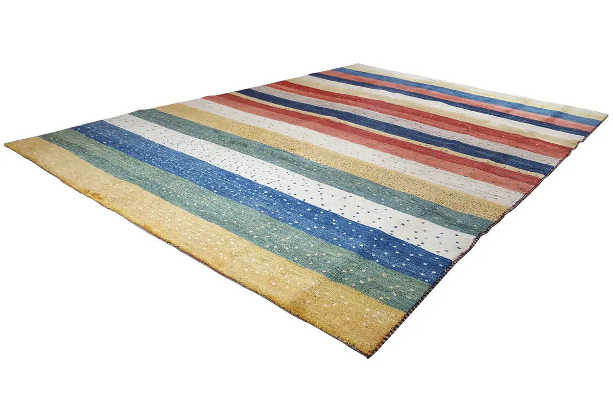 Striped Gabbeh rug, diagonal view with light blue, red, and beige bars