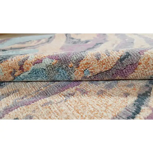 Carpet surface with a multicolored, abstract color swirl and short pile