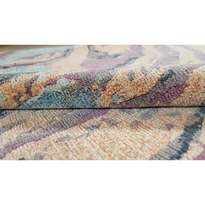 Carpet surface with a multicolored, abstract color swirl and short pile