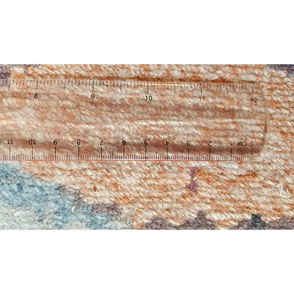 Patterned carpet with a tape measure for measuring pile height, short pile