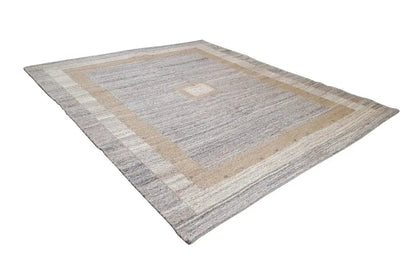Gray-beige kilim rug with a rectangular border pattern and diamond medallion