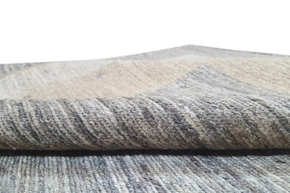 Kilim rug detail: textured pile in light gray with a beige accent stripe