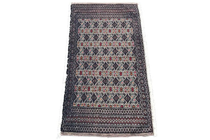 Turkmen Poshti rug, dark blue with a red and beige ornamental pattern, fringes