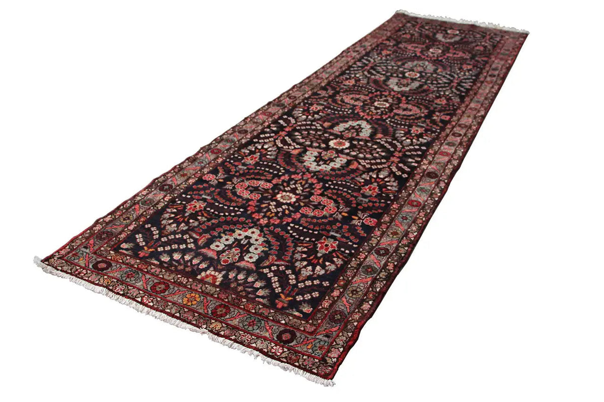 Dark blue Hamadan runner with red and beige ornaments, fringes along the edges
