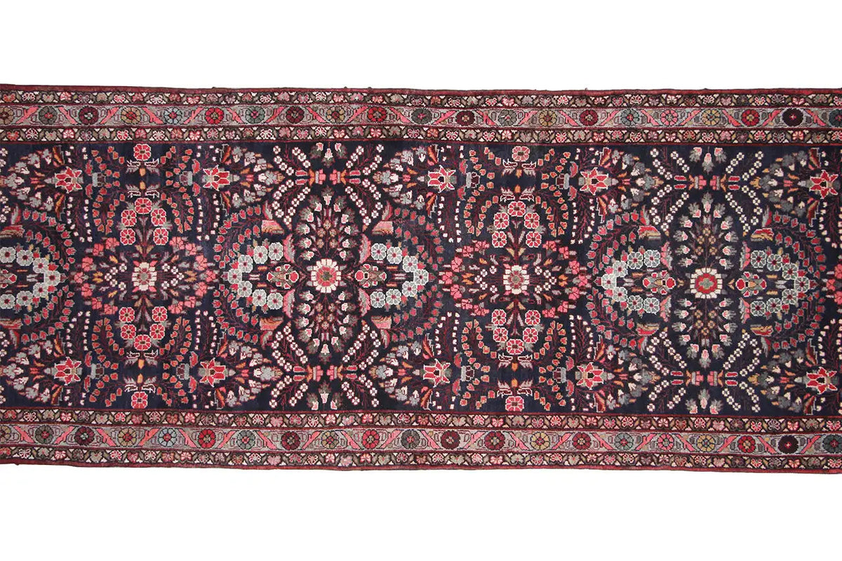 Hamadan runner detail: dark patterned field with fine red, white and beige motifs