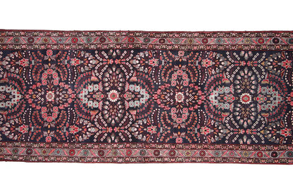 Hamadan runner detail: dark patterned field with fine red, white and beige motifs