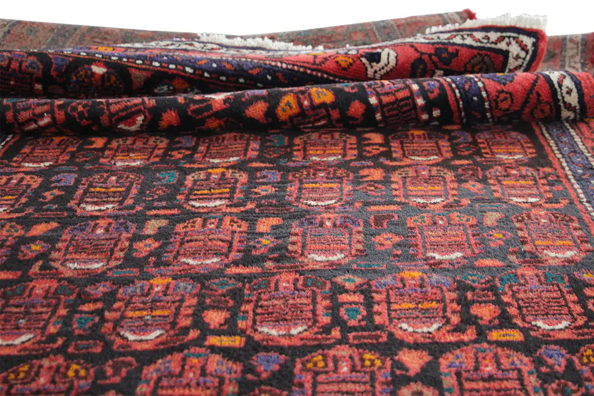 Hamadan runner rolled: flat pattern in red, blue and dark brown, colorful border
