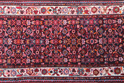 Detailed view: runner with a dark blue-red pattern, delicate ornaments and borders
