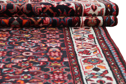 Folded runner with a dark red ornamental pattern and a wide central border