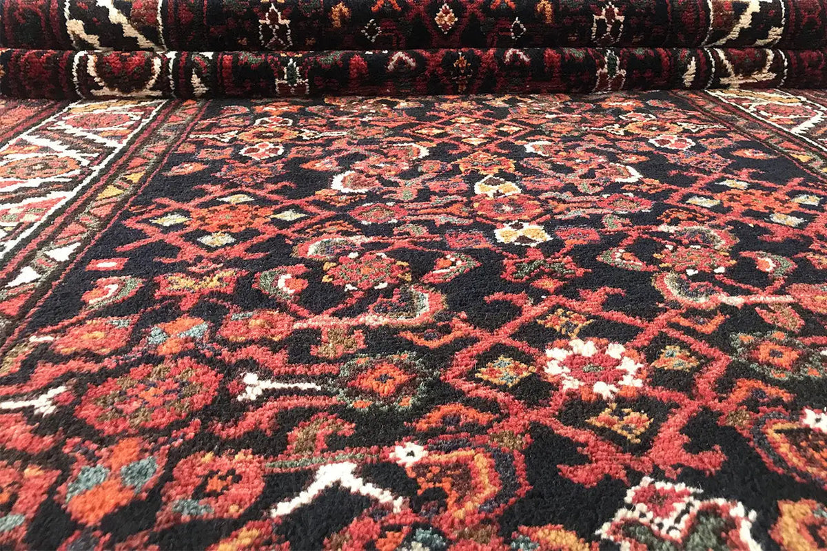 Front view of the Oriental rug runner with a dense pattern and surrounding border