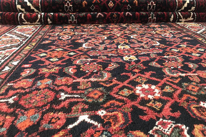 Front view of the Oriental rug runner with a dense pattern and surrounding border