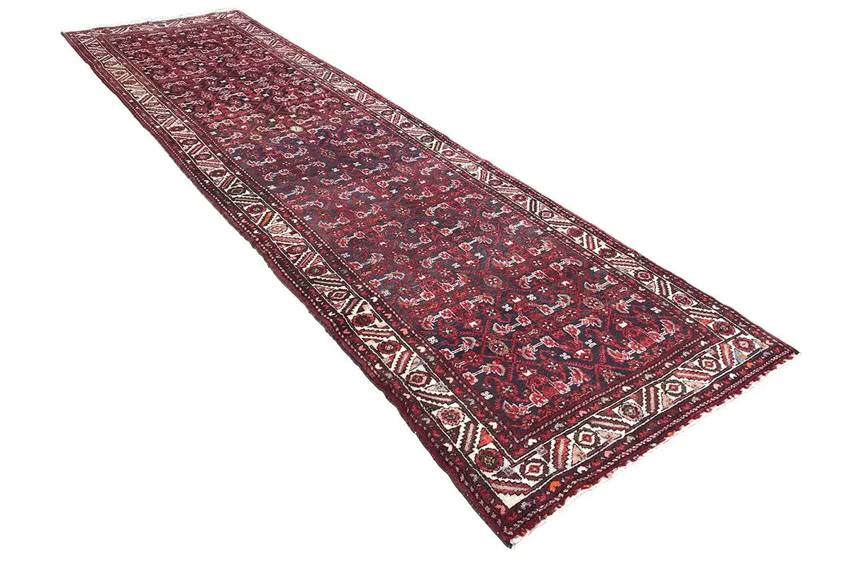 Red-and-blue runner with a small-scale pattern and border along the edges