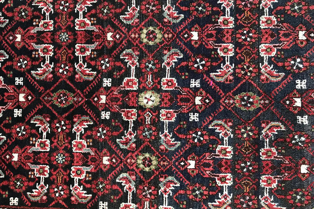 Detailed view: dark red runner with countless small geometric motifs
