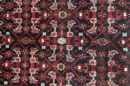 Detailed view: dark red runner with countless small geometric motifs