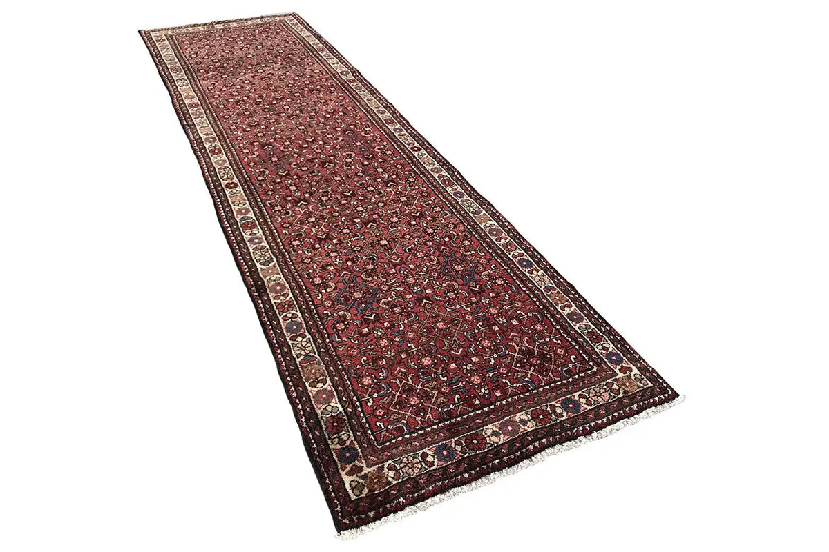 Hamadan runner in burgundy with a dark blue border and ornamentally patterned fields