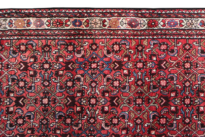 Hamadan runner, close-up: burgundy patterns with dark blue and beige ornaments