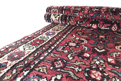 Hamadan runner, side view: dense pattern and folded edge with fringes