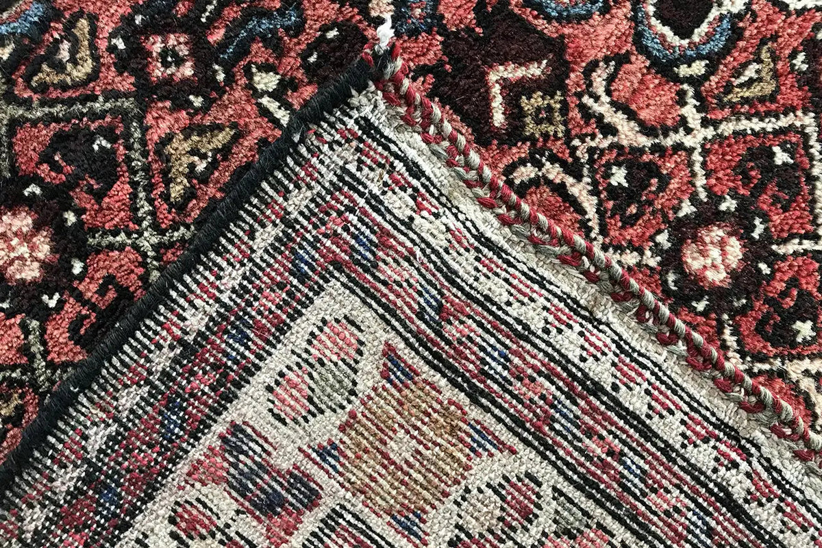Hamadan runner, weave detail: textured pile with red, beige, and blue-black ornaments