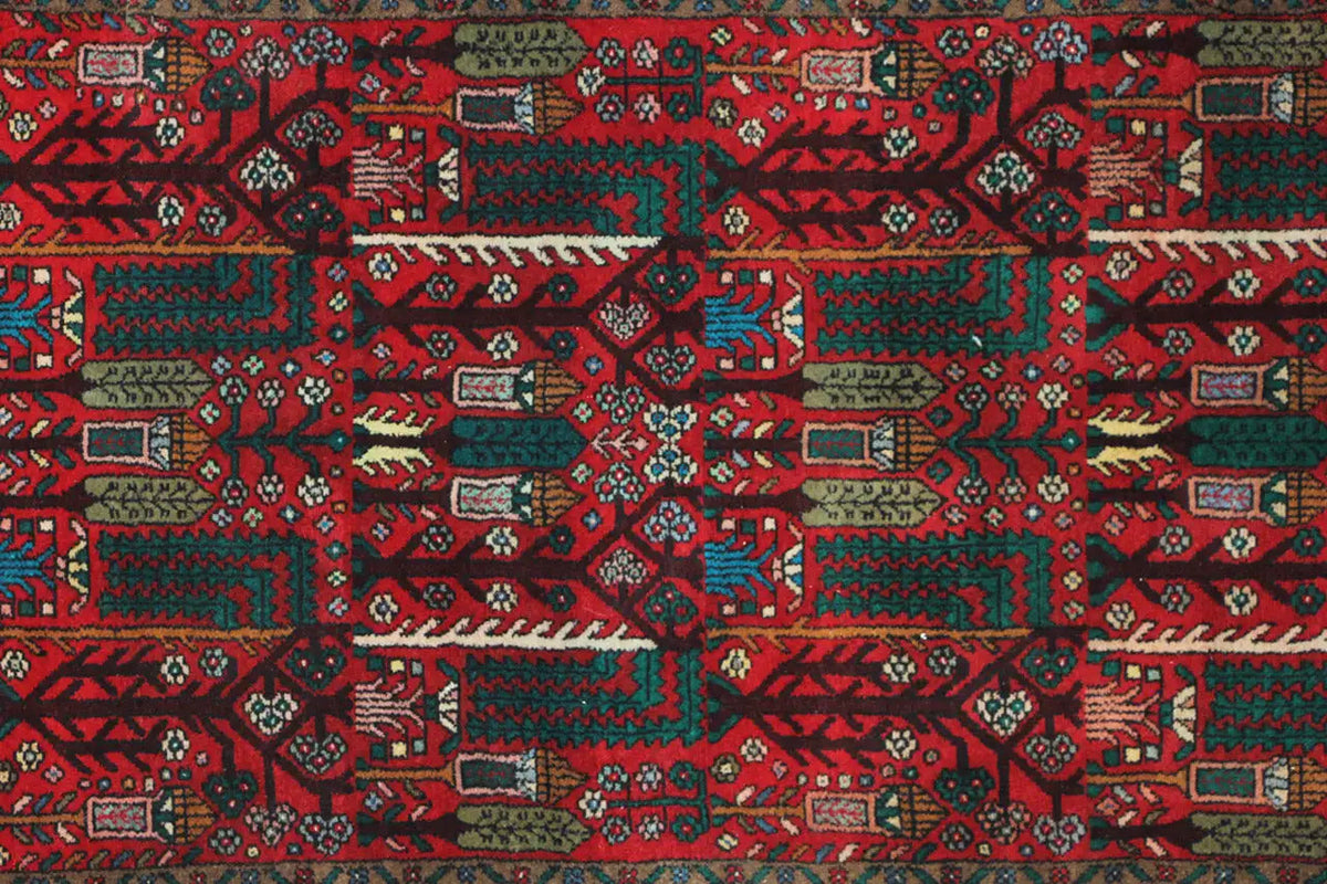 Hamadan runner top view: dense red ornamental pattern with turquoise and green contrast.