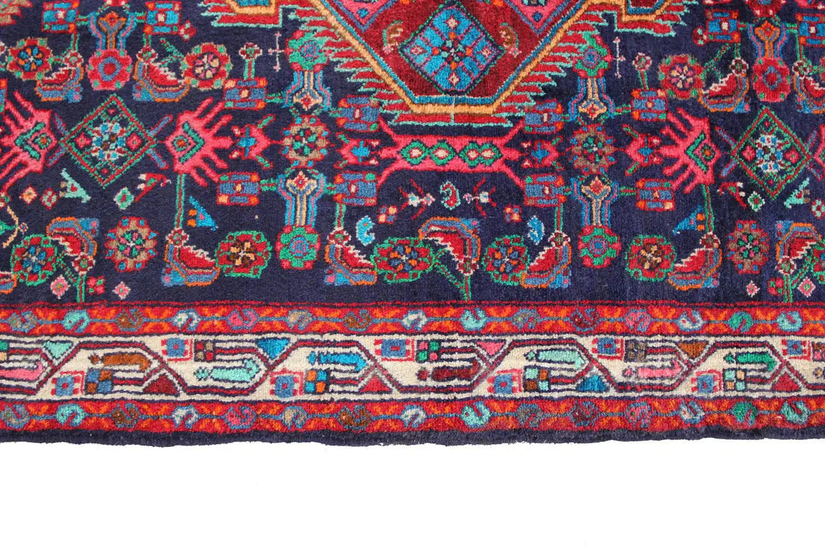 Detailed view of the lower border with decorative bands in red, blue, green and beige