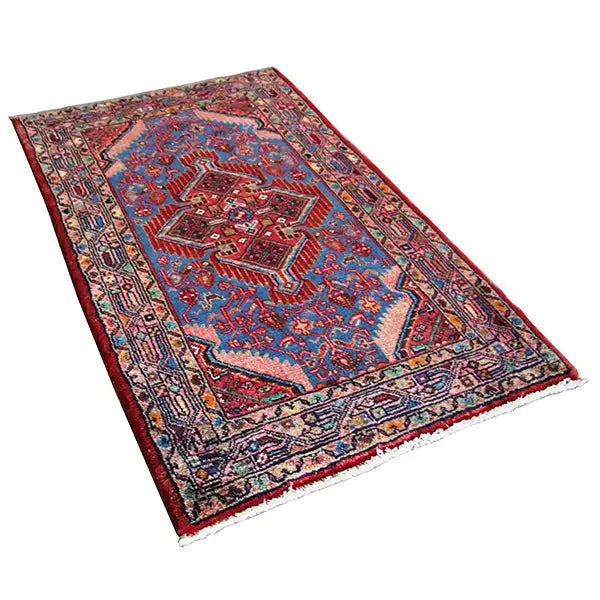 Hamadan rug (132x80 cm), blue with a red border pattern, curved fringe tassels