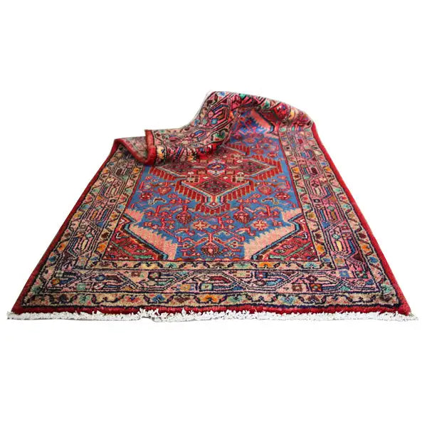 Hamadan rug (132x80 cm), folded: blue medallion, red border, fringes