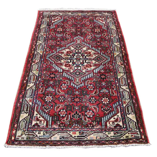 Hamadan rug, red with a cream-colored ornamental pattern and a wide border frieze