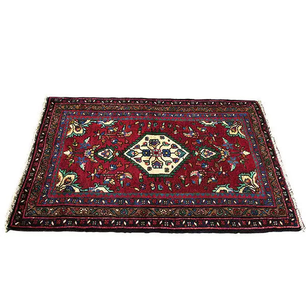 Oriental rug with a red background, ornamental pattern, and narrow border border