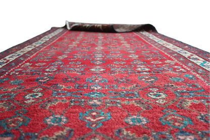 Hamadan runner view from above: red ornamental pattern with a bordered trim.