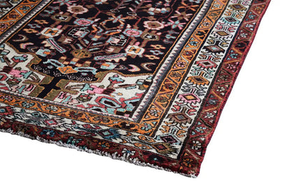 Oriental rug runner with a wide border and multicolored pattern, visible edge finishing
