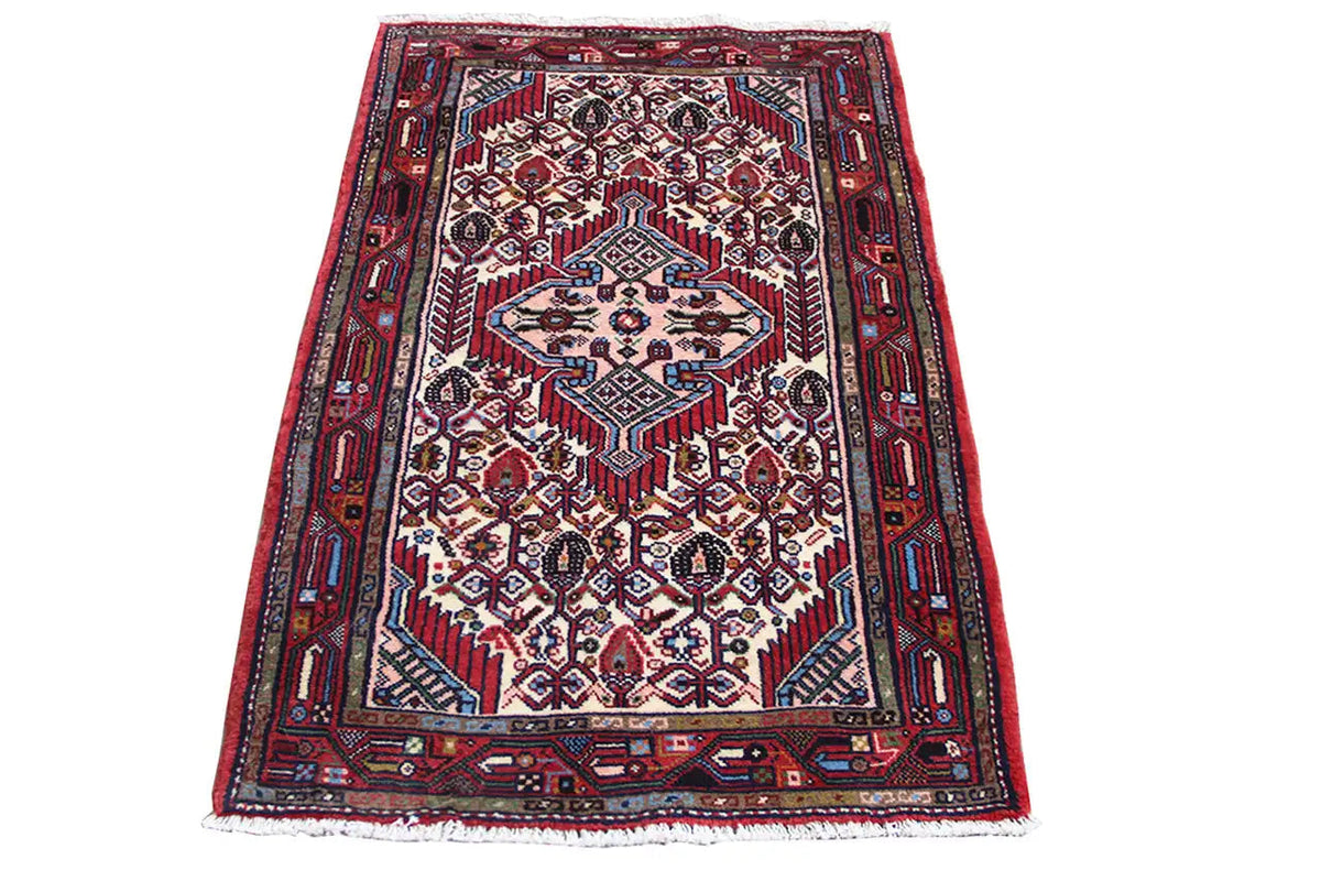 Hamadan rug with a red background and blue-and-white geometric patterns, rectangular