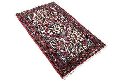 Hamadan rug, oriented diagonally, red pattern with blue and white details