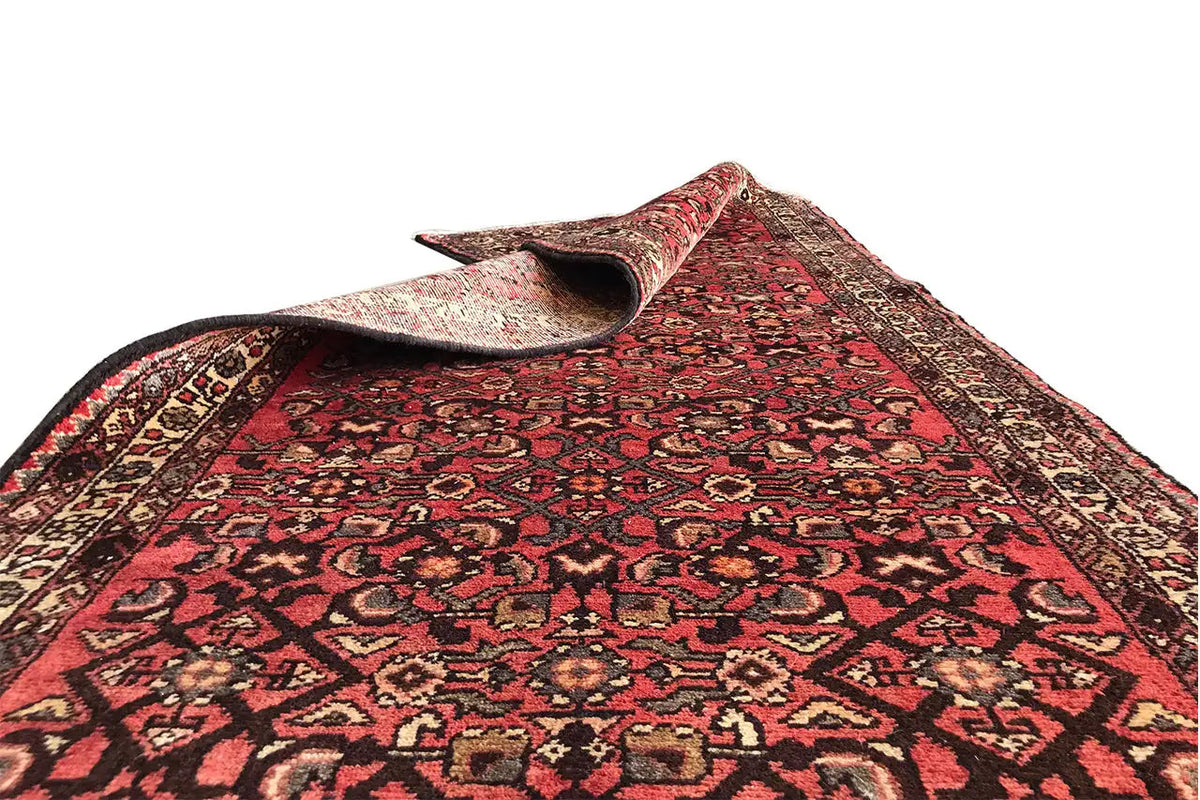 Oriental rug runner, red field with dark medallions and beige decorative stripes