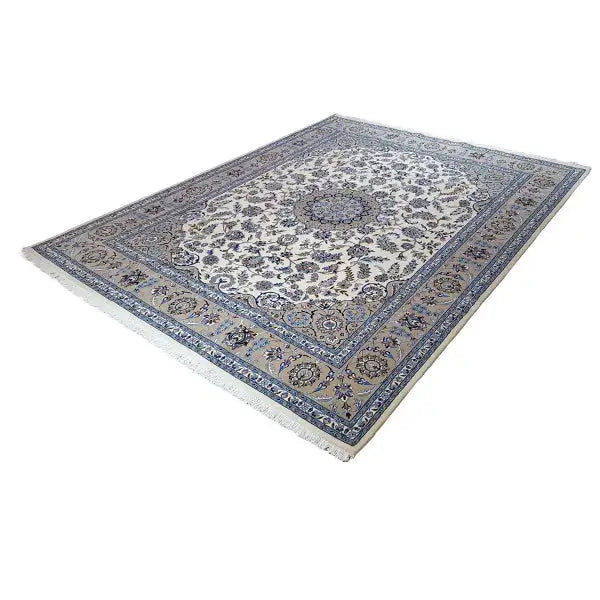 Oriental rug with a cream-colored field and blue medallion ornament