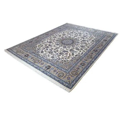 Oriental rug with a cream-colored field and blue medallion ornament