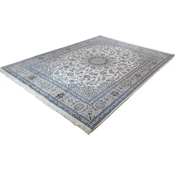 Oriental rug with a cream-colored field, blue border, and decorative pattern