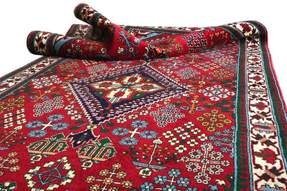 Josheghan runner 370x112 cm, shown rolled, red ornamental pattern and border trim