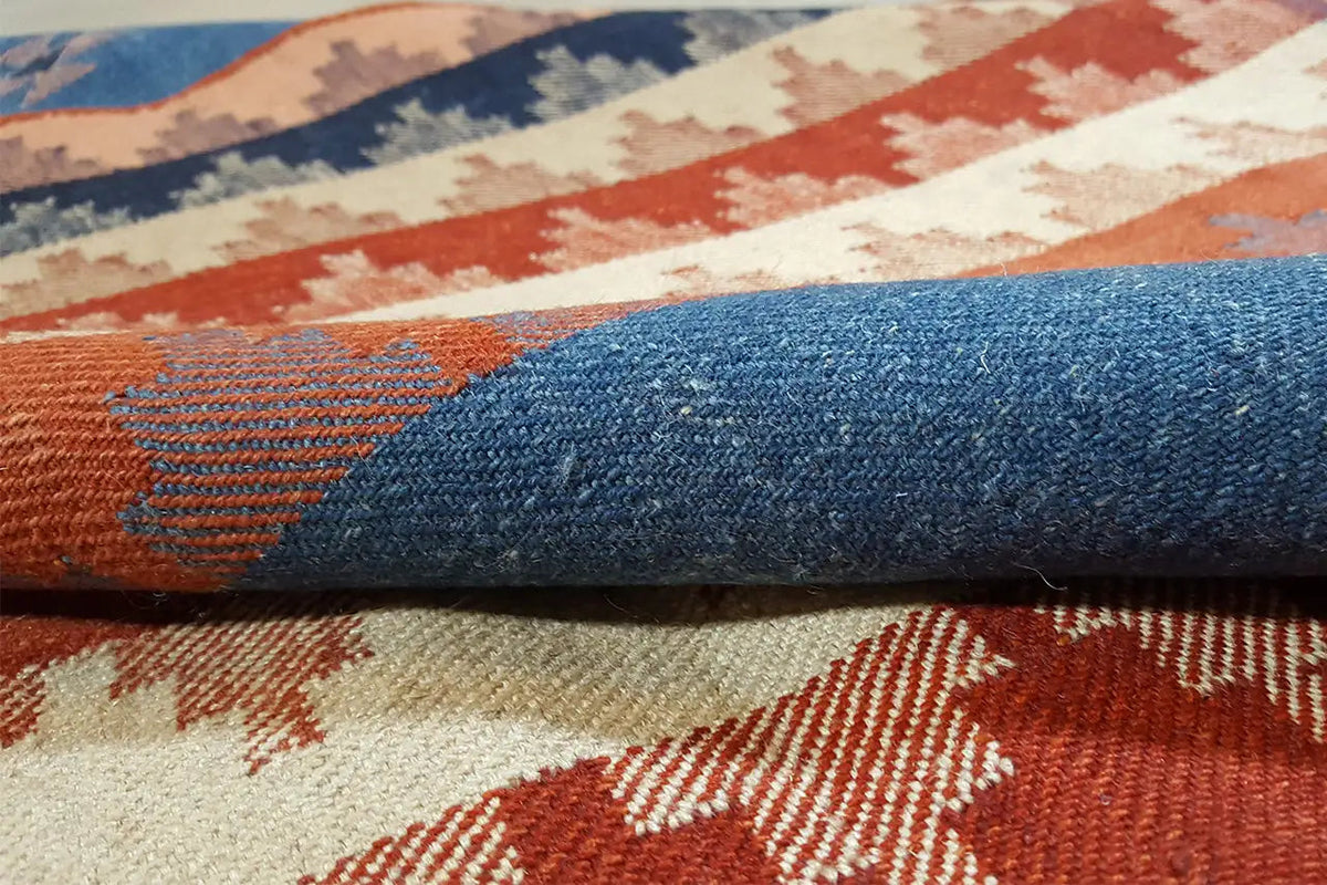 Carpet surface with a dense striped pattern, blue and rust red