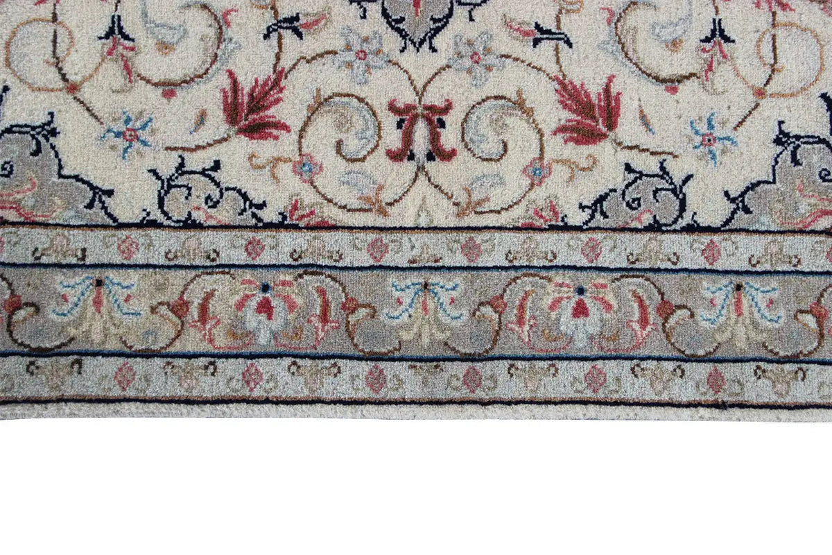 Lower carpet border: beige background with a blue border stripe and red accents