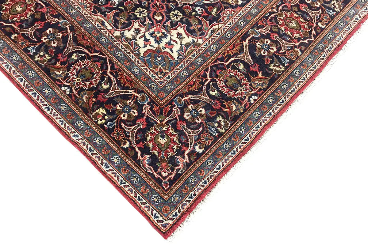 Oriental rug corner in dark red with an ornamental border and fine details
