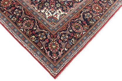 Oriental rug corner in dark red with an ornamental border and fine details