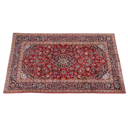 Rectangular Oriental rug, red with an ornamental pattern and dark decorative border