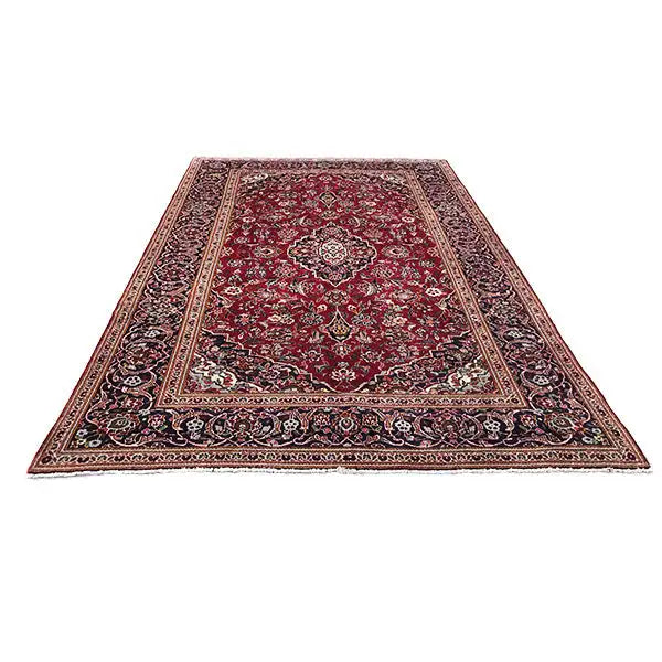 Red Oriental rug with a centered medallion and decorative border bands