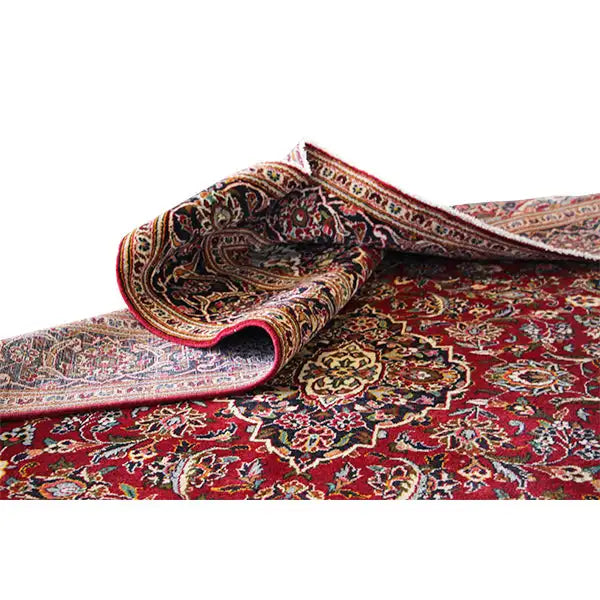 Red Oriental rug, rolled edge with pattern and multicolored decorative border
