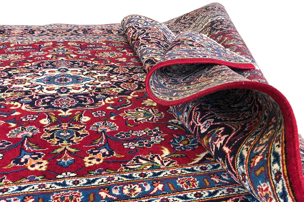 Keshan rug, red multicolored pattern, rolled edge with blue border