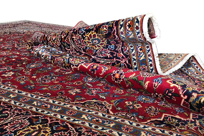 Red Keshan carpet, border pattern with blue-and-white stripes, rolled-up carpet edge