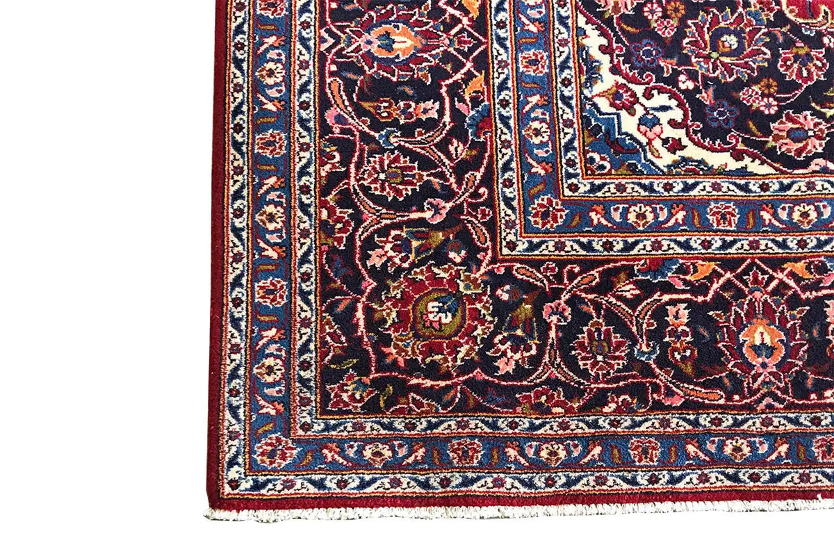 Keshan rug border with a red background, blue-and-white border elements, and ornaments