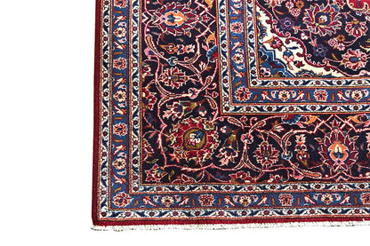 Keshan rug border with a red background, blue-and-white border elements, and ornaments