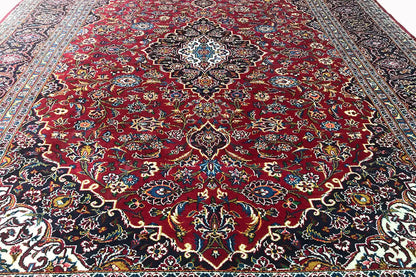 Keshan rug in red with a central medallion and delicate floral pattern gradient